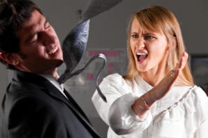 A woman slapping a man's face