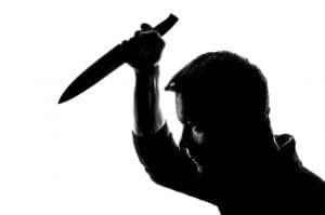 silhouette of a man with a knife