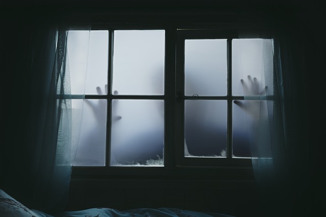 creepy hands behind steamed windows