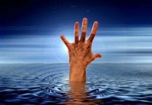 A hand sticking up out of the water, as if begging to be saved