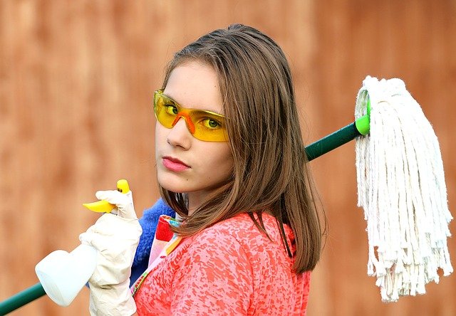 girl with mop and spray